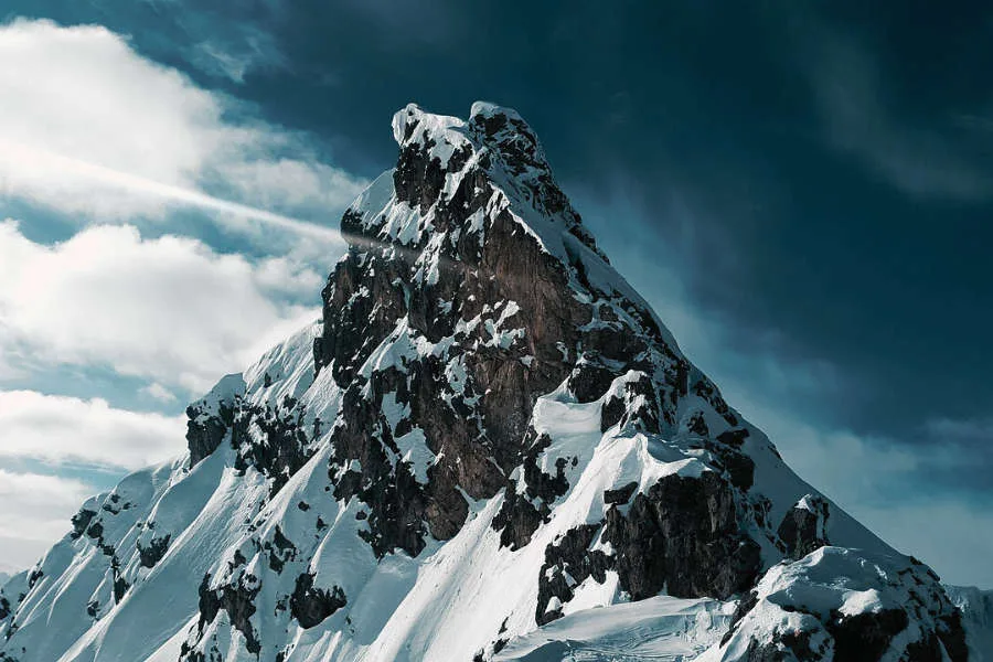 A breathtaking view of a mountain summit, symbolizing the ultimate goal and all the steps to achieving your goals.
