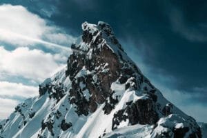 A breathtaking view of a mountain summit, symbolizing the ultimate goal and all the steps to achieving your goals.