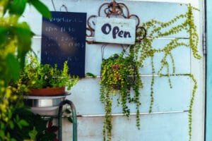 Open sign — symbolising starting a business while working full-time